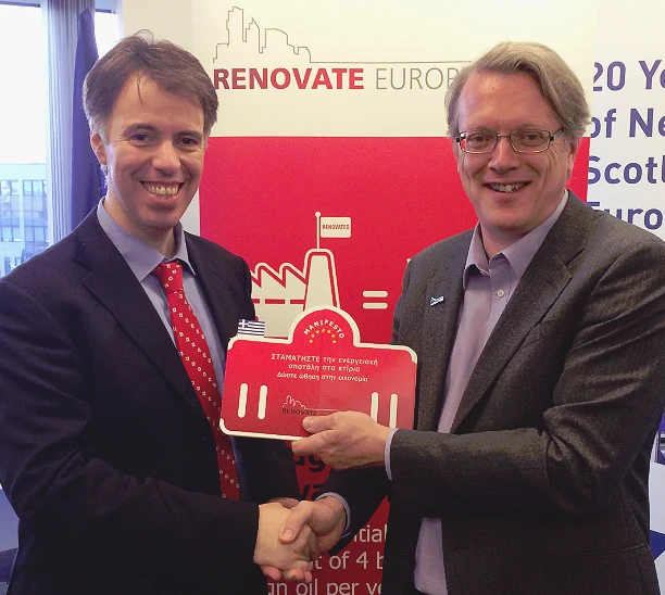 Theodoros Christopoulos and Adrian Joyce holding the manifesto at its launch