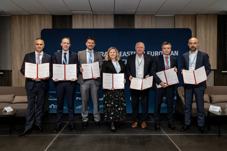 Industry representatives holding the signed joint commitment at the C4E Forum 2023