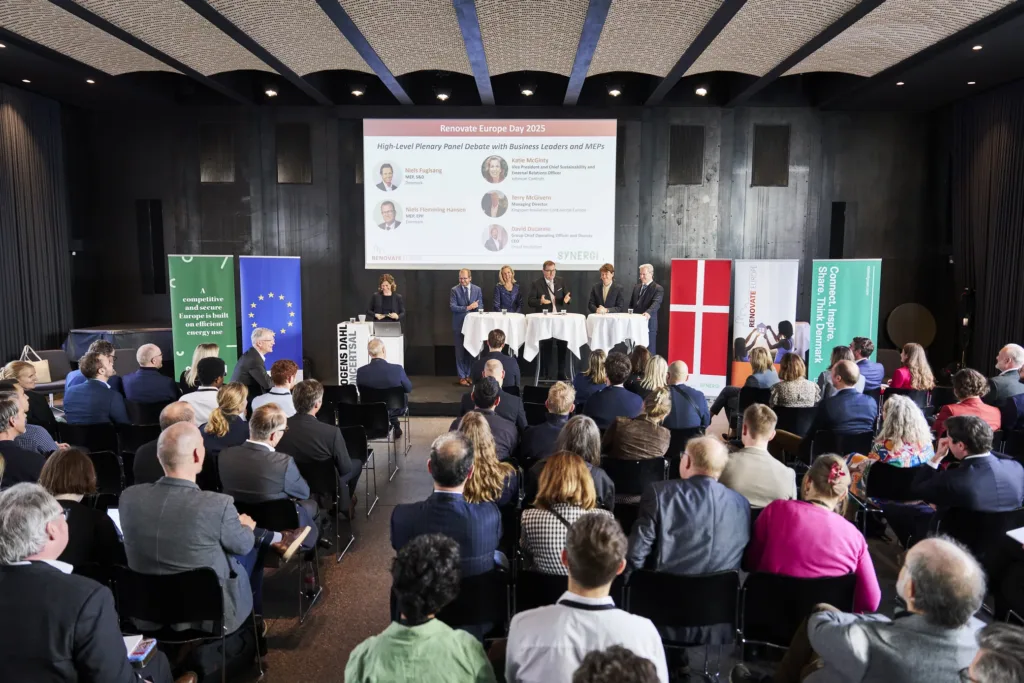A full conference hall facing the panel stage at Renovate Europe Day 2025 in Copenhagen